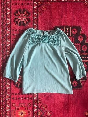 Ann Taylor turquoise blouse with flower ruffles